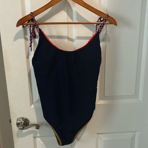 Size m nwot one piece strappy detail, gold detail, blue bathing suit